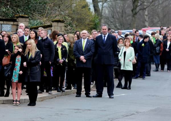 Funeral of Ben King, who has died of cancer. Mourners were invited to wear an item of lime green which was his favourite colour and his dog Bubba lead the coffin into the crematorium. Picture by Paul Heyes
