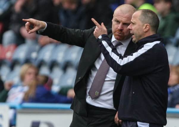 Sean Dyche confers with assistant Ian Woan