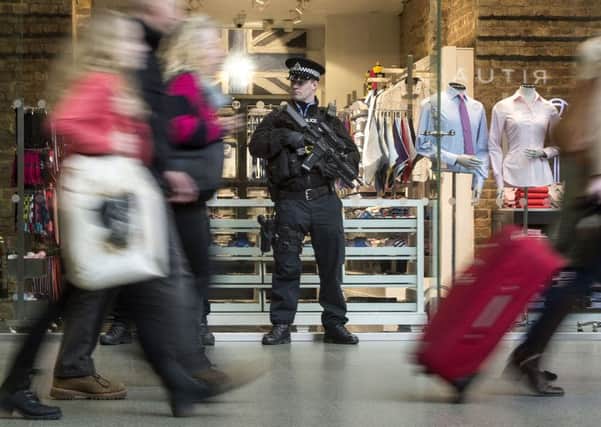 Armed police close to the Eurostar terminal in St Pancras International station, London, in the wake of coordinated bomb attacks on the main airport and the Metro system in Brussels