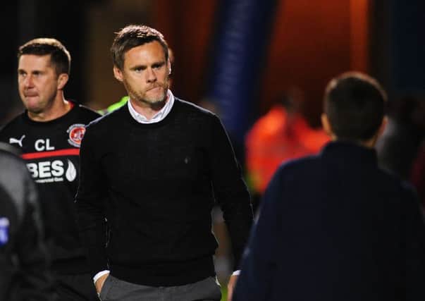 Former Fleetwood Town manager Graham Alexander walks to the dugouts before kick-off against Gillingham . Photographer Kevin Barnes/CameraSport.
