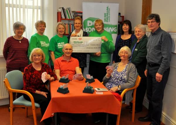 Ribble Valley Macmillan 100 Club are presented with a cheque by members of Brierfield Bridge Club. (s)
