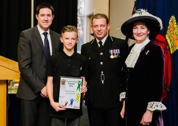 Adam Broxton collects his Young Citizen of the Year award
