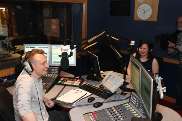 Darren Milby, presenter with The Bay radio, with Faye Bowness in the studio on St George's Quay.
