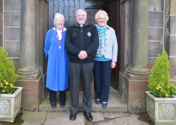 BEST WISHES: Father Keith Henshall with church wardens Miriam Shorrock and Ruth Pickles