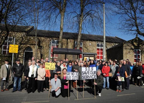 Sabden residents put on an impressive display of protest over plans to axe their bus service.
Protestors gather around the village bus stop.  PIC BY ROB LOCK
14-3-2016