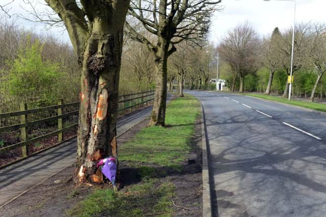 Tributes left at the scene where a 16-year-old boy has died after the car he was driving left the road and hit a tree. The teenager was driving a blue BMW 318 SE in Burnley, Lancashire, when he tried to overtake another vehicle and lost control, police said. He suffered multiple injuries in the crash in Ridge Avenue at about 9.40pm on Thursday and died later at the Royal Blackburn hospital. 8 April 2016.