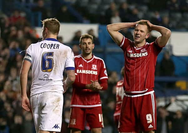 Middlesbrough's Jordan Rhodes (right) looks dejected during the Sky Bet Championship match at Elland Road, Leeds. PRESS ASSOCIATION Photo. Picture date: Monday February 15, 2016. See PA story SOCCER Leeds. Photo credit should read: Tim Goode/PA Wire. RESTRICTIONS: EDITORIAL USE ONLY No use with unauthorised audio, video, data, fixture lists, club/league logos or "live" services. Online in-match use limited to 75 images, no video emulation. No use in betting, games or single club/league/player publications.