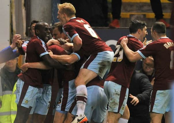 Michael Keane is mobbed by team mates after he scored the late equaliser