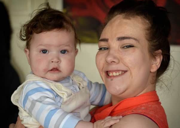 Chantelle Ryan and her son Francis.  Chantelle was a burns victim as a baby and later told she would not be able to have children of her own.
