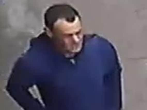 The man police want to speak to in connection with the robbery. (s)