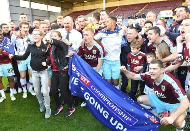 Sam Vokes, front right, celebrates promotion with the squad, staff and families