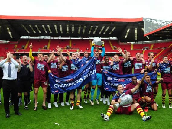 Sean Dyche and his team celebrate promotion at full time