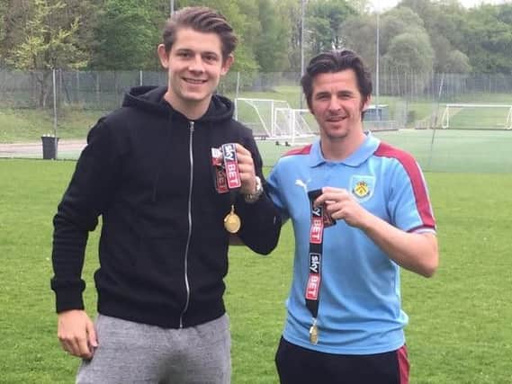 James Tarkowski and Joey Barton with their medals