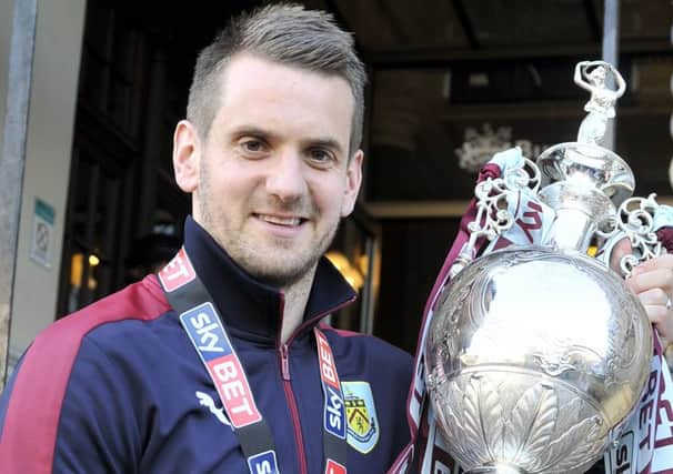 PHOTO. KEVIN McGUINNESS. Tom Heaton with the trophy