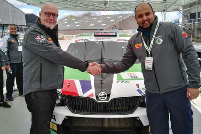 John Williams, event organiser from Simpsons Skoda shakes hands with Ayub Moosa, Industry Links Manager for the STEM department at Blackburn College (s)