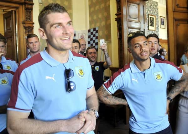 The players wait to be presented to the crowd at Burnley Town Hall