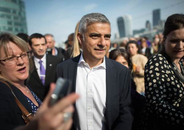 Mayor of London Sadiq Khan arrives at City Hall in London, on his first day as mayor. Photo: Stefan Rousseau/PA Wire