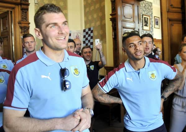 Sam Vokes and Andre Gray wait to be presented to the crowd at Burnley Town Hall