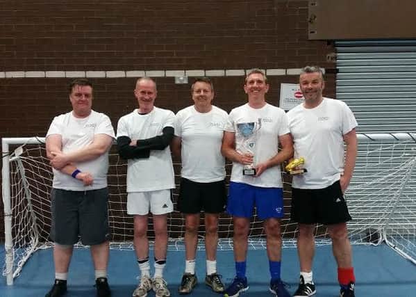 Walking Football team champions from left to right, Simon Clark (52), John Royal (52), Barry Wood (55), Stuart Downham (53) and Stuart Thomson. (53) seen holing the 'golden boot' for best player of the tournament! (s)