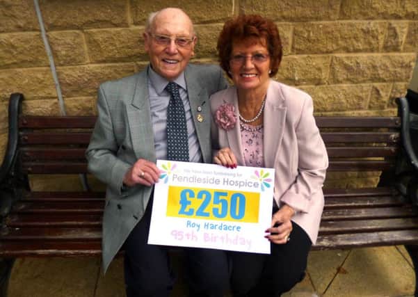 Roy Hardacre and Barbara Wright-Hurst with the donation to Pendleside Hospice