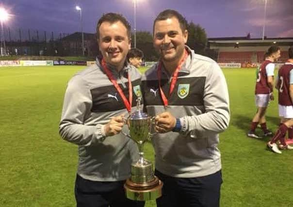 Blessed Trinity PE Teachers Marshall Holding and John Kelly with the  trophy