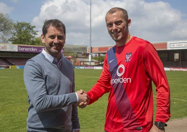 York City Manager Jackie McNamara with Jack Higgins, from Burnley, who has just signed a two-year deal with the club and will be leaving his position as a sports coordinator at Park Primary School in Colne. Photo: Mark Comer.