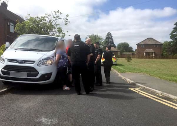 Police speaking to a group of travellers following a confrontation on Winton Road, Lowton