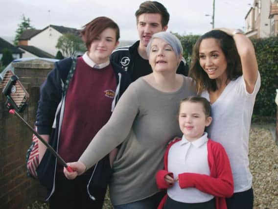 Myleene Klass (far right) joins older single mum Rhiannon Hewitt with her children, Erin, Rhys and Tegan, for a selfie at their home in  Buckley, North Wales