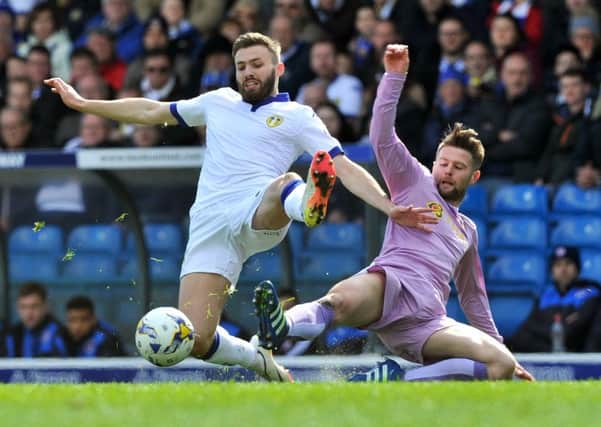 Oliver Norwood, right, challenges international colleague Stuart Dallas at Elland Road in April