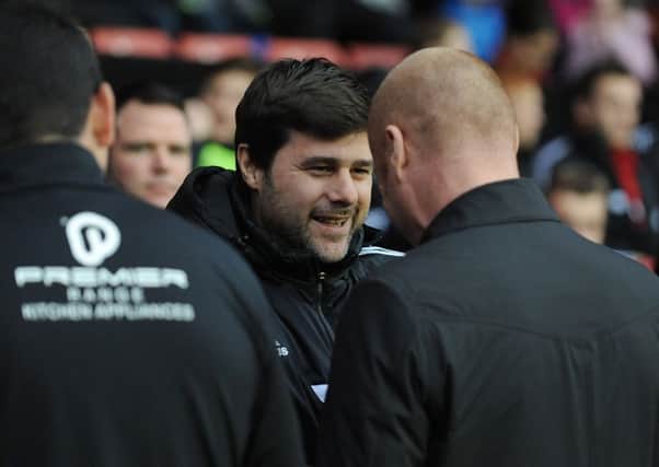 Southampton's Manager Mauricio Pochettino shakes hands with Burnley's Manager Sean Dyche  prior to kick off 

Photo by Ian Cook/CameraSport

Football - FA Challenge Cup Third Round - Southampton v Burnley - Saturday 4th January 2014 - St Mary's Stadium - Southampton

 Â© CameraSport - 43 Linden Ave. Countesthorpe. Leicester. England. LE8 5PG - Tel: +44 (0) 116 277 4147 - admin@camerasport.com - www.camerasport.com