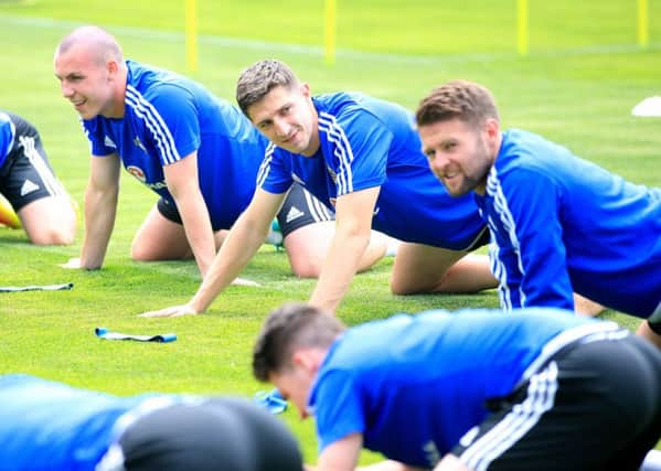 Northern Ireland's Luke McCullough (left), Corry Evans (centre) and Oliver Norwood (right) during a training session at Parc de Montchervet, Saint-Georges-de-Reneins. PRESS ASSOCIATION Photo. Picture date: Wednesday June 8, 2016. See PA story SOCCER N Ireland. Photo credit should read: Jonathan Brady/PA Wire. RESTRICTIONS: Use subject to restrictions. Editorial use only. No commercial use. Call +44 (0)1158 447447 for further information.
