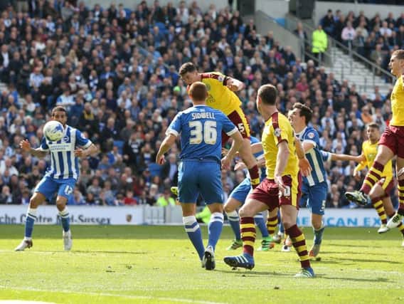 Michael Keane heads the equaliser at Brighton in April