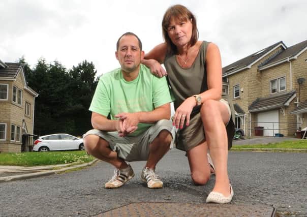 Photo Neil CrossDarren and Susan Ensby, of May Tree Cl, Burnley have been fighting Pendle Council to bring the road up to an adoptable standard.
