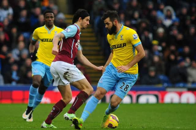 Crystal Palace midfielder Joe Ledley (right) has been linked with a summer move to Turf Moor