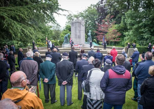 People gathered at Towneley Hall War Memorial to remember the fallen