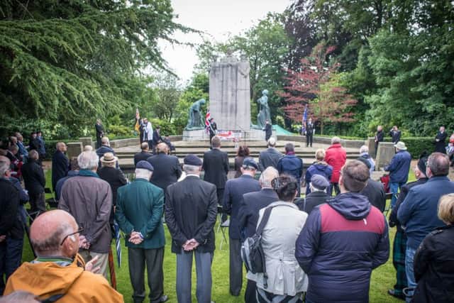 People gathered at Towneley Hall War Memorial to remember the fallen