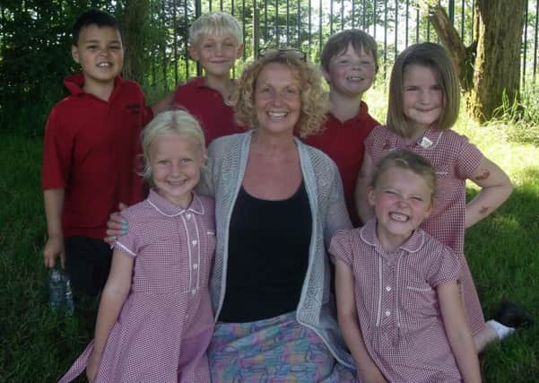 TESTING TIMES: Headteacher Louise Young with pupils at Worsthorne