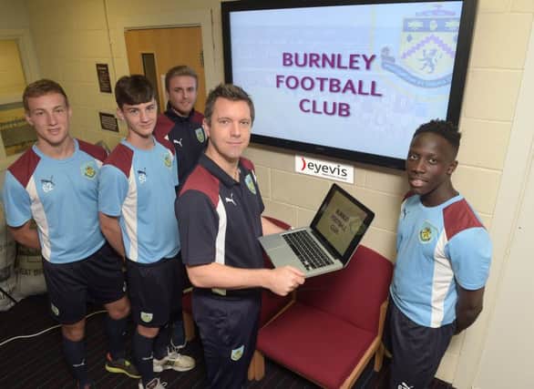 Jason Blake (front centre) pictured with Youth team players Tinashe Chakwana (front right) with Scott Wilson and James Clarke looking on, with Shawn Young, Academy Lead Performance Analyst.