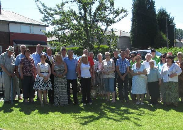 Friends and family of Michelle Holmes at the special garden