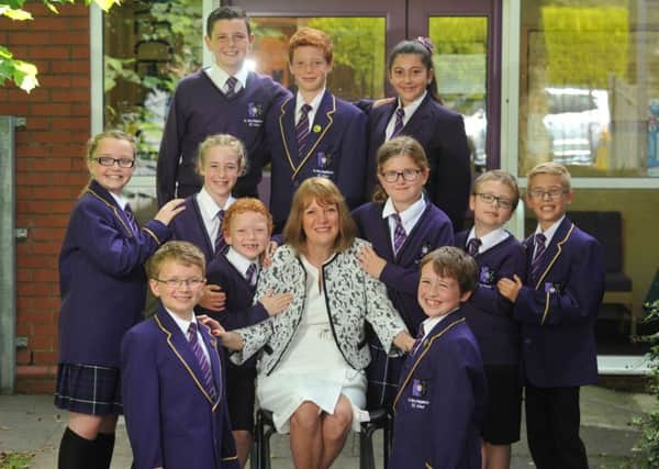 Retiring head Mrs Julie Frazer with her pupils at St Mary Magdalene's Primary School, Wellfield Drive, Burnley