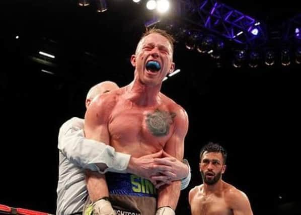 Shayne Singleton celebrates after stopping Adil Anwar at the Manchester Arena (s)