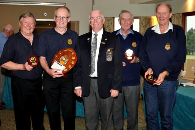 The Rotary Club of Clitheroe win the Lancashire and Cumbria District 1190 Quiz. Pictured from left to right are: Barrie Lancaster, Captain Bill Honeywell, District Governor Arthur Jones, Jeff Robbins and Mike Watkins. (s)