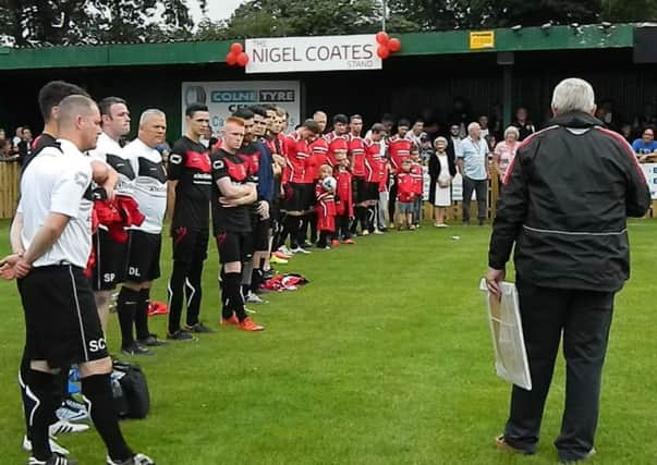 Players line up in front of the stand renamed in Nigel's memory