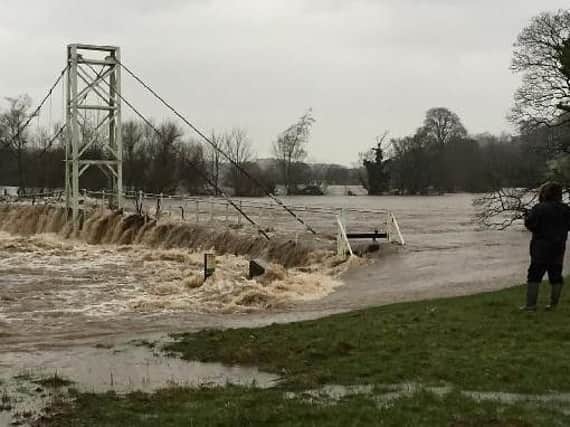 Dinckley footbridge almost disappears under the raging River Ribble during the December, 2015 storms