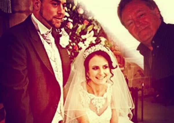 Natasha and Edward on their wedding day with Simon