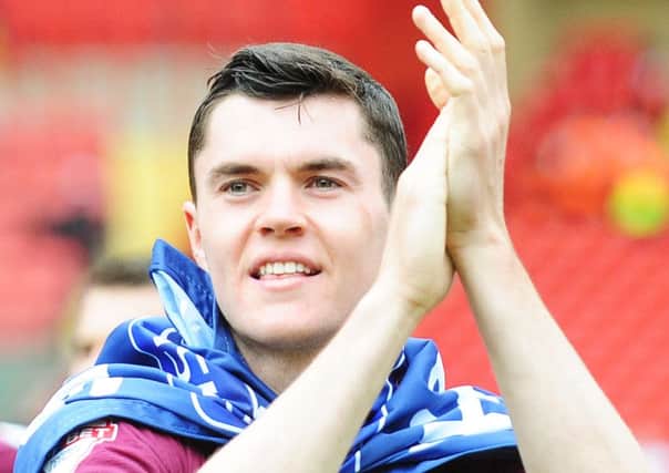 Burnley's Michael Keane celebrates his side becoming champions of the Sky Bet Championship

Photographer Kevin Barnes/CameraSport

Football - Sky Bet Football League Championship - Charlton Athletic v Burnley - Saturday 7th May 2016 - The Valley - London

Â© CameraSport - 43 Linden Ave. Countesthorpe. Leicester. England. LE8 5PG - Tel: +44 (0) 116 277 4147 - admin@camerasport.com - www.camerasport.com