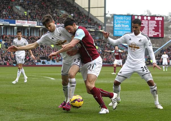 George Boyd runs at the Swansea City defence the last time the two sides met at Turf Moor