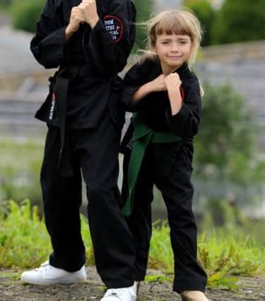 Ray Holloway aged 10 from Burnley is suffering from Leukaemia and has just been awarded an honorary black belt by the martial arts group at St Peters Centre. Seen here with sister Chelsea aged 6. Picture by Paul Heyes, Sunday August 14, 2016.