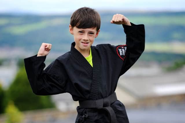 Ray Holloway aged 10 from Burnley is suffering from Leukaemia and has just been awarded an honorary black belt by the martial arts group at St Peters Centre. Picture by Paul Heyes, Sunday August 14, 2016.