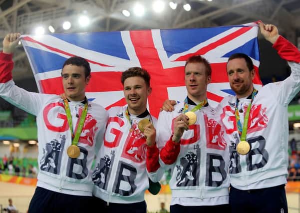 Great Britain's (left-right) Steven Burke, Owain Doull, Ed Clancy and Sir Bradley Wiggins with their gold medals following victory in the men's team pursuit final on the seventh day of the Rio Olympic Games. David Davies/PA Wire